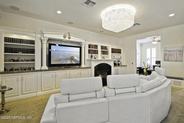 8135 Wekiva Way, Jacksonville, FL 32256 - living room with light carpet, crown molding, a textured ceiling, a lit fireplace, and ceiling fan