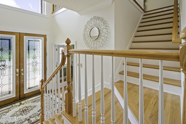 8135 Wekiva Way, Jacksonville, FL 32256 - entrance foyer with french doors, light wood-type flooring, and stairway