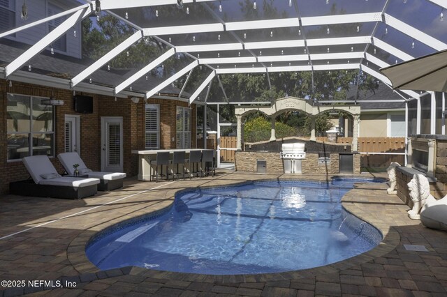 8135 Wekiva Way, Jacksonville, FL 32256 - outdoor pool with exterior kitchen, a patio area, and a lanai
