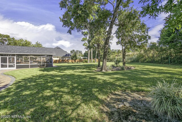 8135 Wekiva Way, Jacksonville, FL 32256 - view of green lawn featuring a sunroom