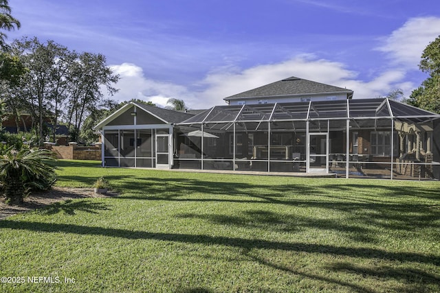 8135 Wekiva Way, Jacksonville, FL 32256 - back of house featuring a yard and glass enclosure
