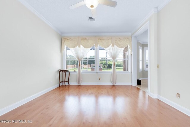 8135 Wekiva Way, Jacksonville, FL 32256 - empty room featuring plenty of natural light, ornamental molding, ceiling fan, wood finished floors, and baseboards