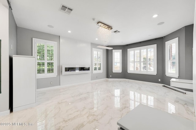 8135 Wekiva Way, Jacksonville, FL 32256 - unfurnished living room with recessed lighting, a chandelier, marble tiled floors, and baseboards