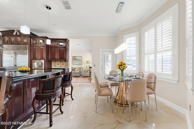 8135 Wekiva Way, Jacksonville, FL 32256 - dining area featuring ornamental molding and baseboards