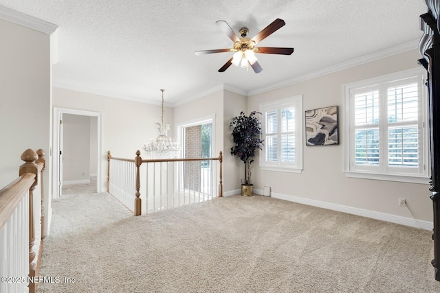 8135 Wekiva Way, Jacksonville, FL 32256 - carpeted spare room with a ceiling fan, a chandelier, a textured ceiling, baseboards, and ornamental molding