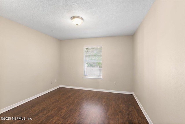 12142 Corner Oaks Dr, Jacksonville, FL 32223 - empty room featuring dark wood-style floors, baseboards, and a textured ceiling