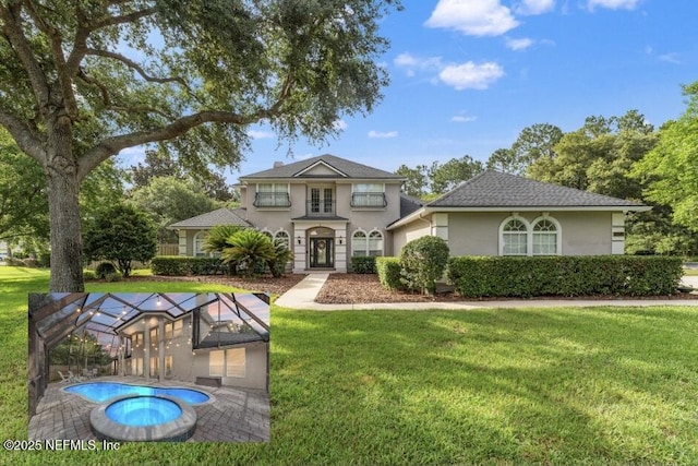 1612 Inkberry Ln, Saint Johns, FL 32259 - traditional-style house with stucco siding, a front lawn, glass enclosure, and an outdoor pool