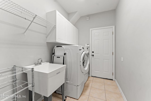 1612 Inkberry Ln, Saint Johns, FL 32259 - washroom with washer and dryer, cabinet space, and light tile patterned floors