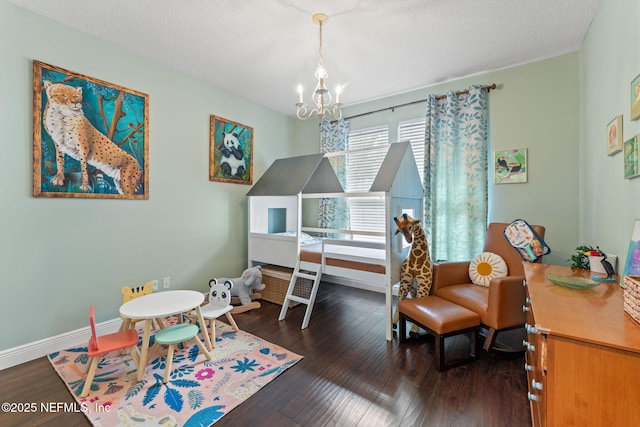 1612 Inkberry Ln, Saint Johns, FL 32259 - playroom featuring a chandelier, wood finished floors, and a textured ceiling