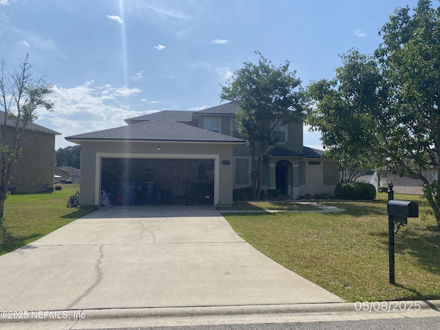 11495 Tori Ln, Jacksonville, FL 32218 - view of front of property with a garage, concrete driveway, a front lawn, and stucco siding