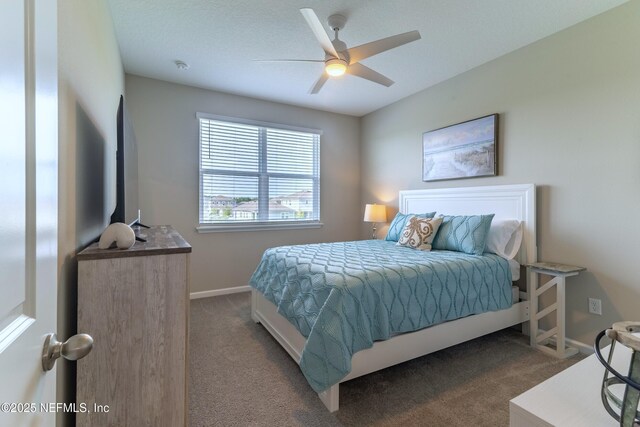 760 Cherry Elm Dr, Saint Augustine, FL 32092 - bedroom with dark carpet, baseboards, and ceiling fan