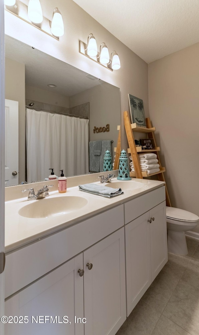 760 Cherry Elm Dr, Saint Augustine, FL 32092 - bathroom featuring tile patterned flooring, double vanity, toilet, and a shower with curtain