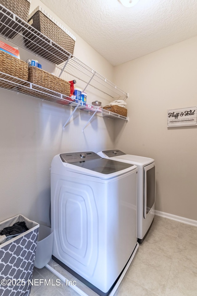 760 Cherry Elm Dr, Saint Augustine, FL 32092 - washroom featuring washing machine and dryer and baseboards