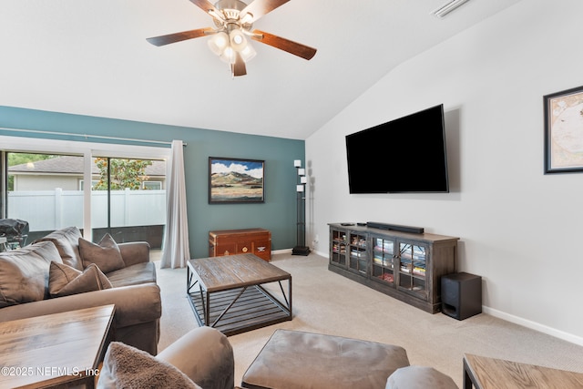 11521 Dunforth Cove Dr, Jacksonville, FL 32218 - living area featuring carpet, vaulted ceiling, baseboards, and a ceiling fan