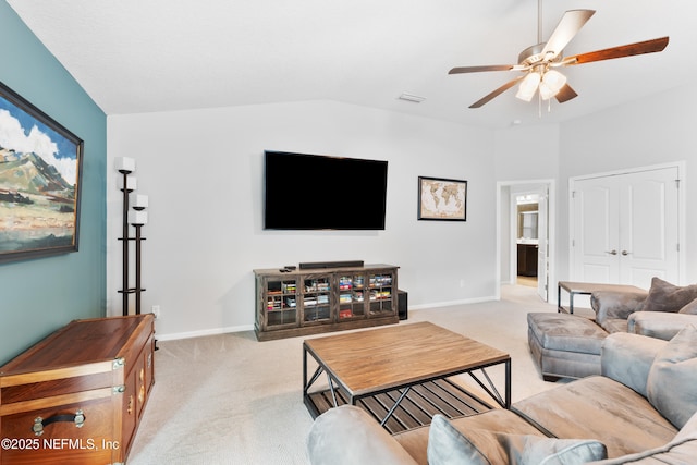 11521 Dunforth Cove Dr, Jacksonville, FL 32218 - carpeted living area with ceiling fan, baseboards, and lofted ceiling