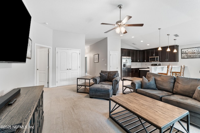 11521 Dunforth Cove Dr, Jacksonville, FL 32218 - living room with ceiling fan, light colored carpet, vaulted ceiling, and recessed lighting