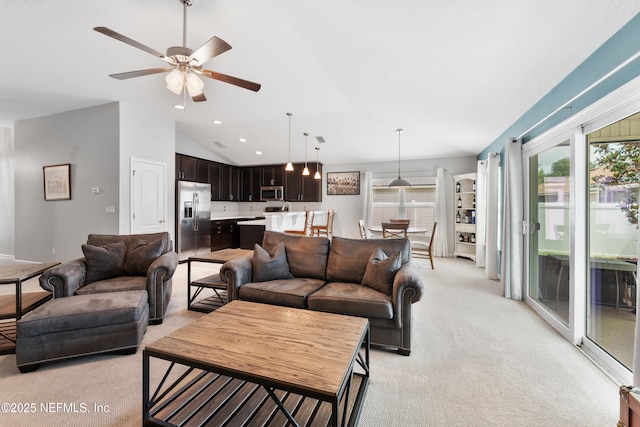 11521 Dunforth Cove Dr, Jacksonville, FL 32218 - living area with light carpet, vaulted ceiling, a ceiling fan, and recessed lighting