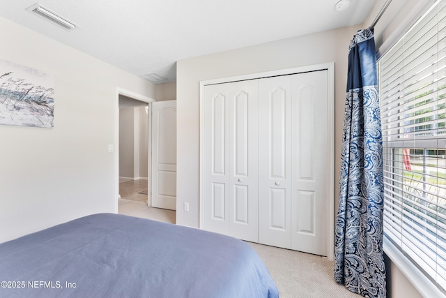 11521 Dunforth Cove Dr, Jacksonville, FL 32218 - bedroom featuring light carpet and a closet