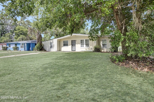9118 Devonshire Blvd, Jacksonville, FL 32208 - view of front facade with a front yard