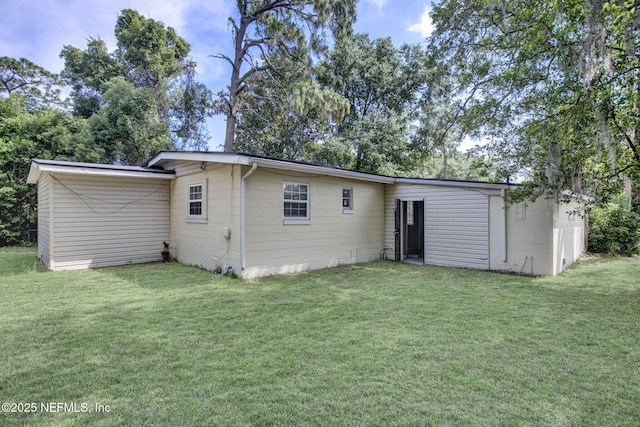 9118 Devonshire Blvd, Jacksonville, FL 32208 - rear view of house with a yard