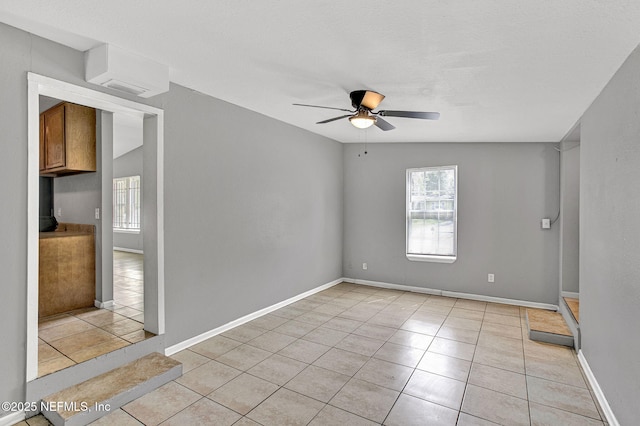 9118 Devonshire Blvd, Jacksonville, FL 32208 - spare room featuring a ceiling fan, light tile patterned floors, and baseboards