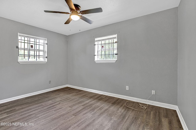 9118 Devonshire Blvd, Jacksonville, FL 32208 - spare room with wood finished floors, a ceiling fan, and baseboards