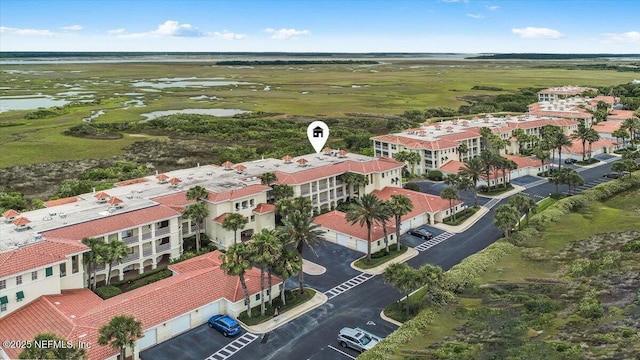 215 S Ocean Grande Dr Unit 105, Ponte Vedra Beach, FL 32082 - drone / aerial view of a nearby body of water and apartment complex / building