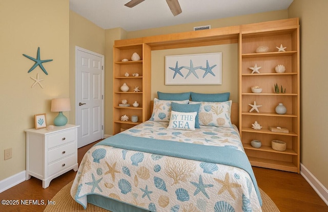 215 S Ocean Grande Dr Unit 105, Ponte Vedra Beach, FL 32082 - bedroom with baseboards, wood finished floors, and ceiling fan