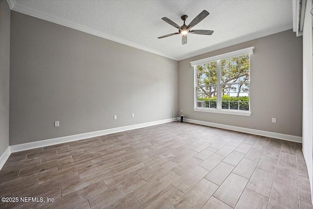 215 S Ocean Grande Dr Unit 105, Ponte Vedra Beach, FL 32082 - spare room with a textured ceiling, ceiling fan, crown molding, wood finished floors, and baseboards