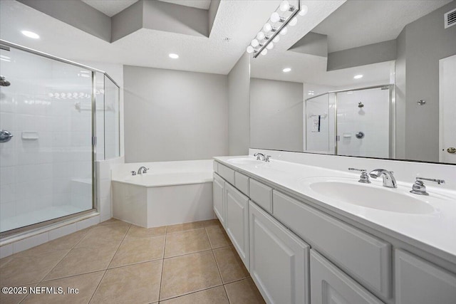 215 S Ocean Grande Dr Unit 105, Ponte Vedra Beach, FL 32082 - full bath with a garden tub, a shower stall, double vanity, tile patterned floors, and recessed lighting