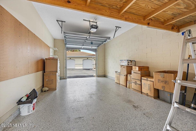 215 S Ocean Grande Dr Unit 105, Ponte Vedra Beach, FL 32082 - garage with concrete block wall and a garage door opener