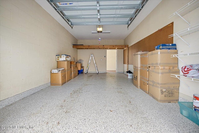 215 S Ocean Grande Dr Unit 105, Ponte Vedra Beach, FL 32082 - garage featuring a garage door opener and concrete block wall