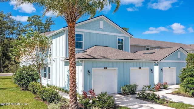 412 Talulla Trl, Saint Augustine, FL 32095 - traditional-style home with roof with shingles, a garage, and board and batten siding