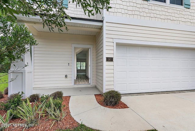 187 Logrono Ct, Saint Augustine, FL 32084 - doorway to property featuring a garage and driveway