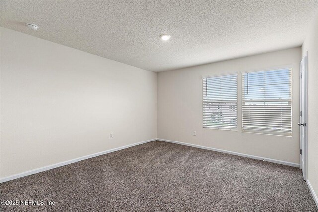 187 Logrono Ct, Saint Augustine, FL 32084 - empty room with carpet, baseboards, a textured ceiling, and a smoke detector