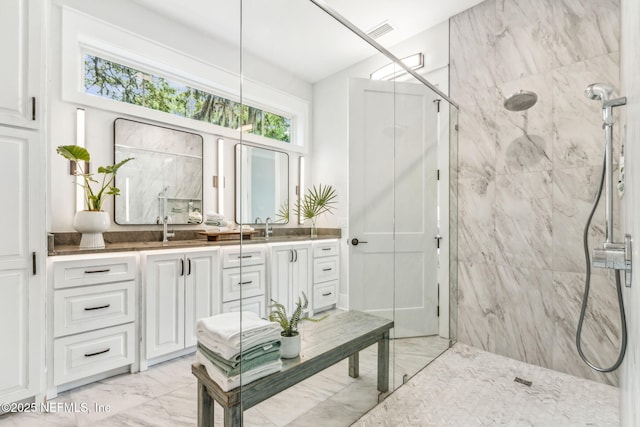 22 N 17th St, Amelia Island, FL 32034 - bathroom with marble look tiles, a marble finish shower, and vanity