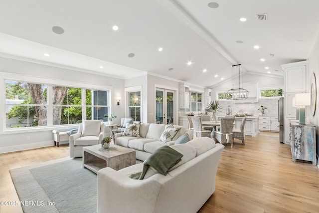 22 N 17th St, Amelia Island, FL 32034 - living room with healthy amount of natural light, light wood finished floors, recessed lighting, and ornamental molding
