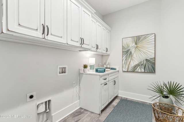 22 N 17th St, Amelia Island, FL 32034 - washroom with hookup for an electric dryer, cabinet space, hookup for a washing machine, and baseboards