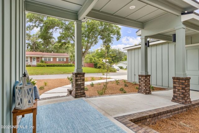 22 N 17th St, Amelia Island, FL 32034 - covered porch featuring a lawn