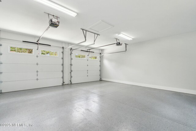 22 N 17th St, Amelia Island, FL 32034 - garage featuring a garage door opener and baseboards