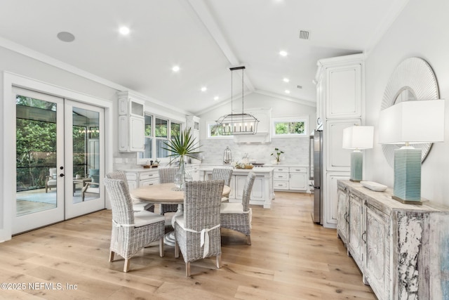 22 N 17th St, Amelia Island, FL 32034 - dining room featuring french doors, a chandelier, and light wood-style flooring