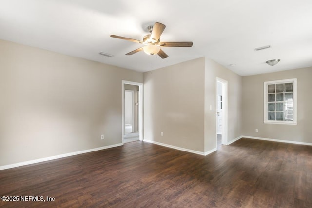 937 Stark St, Jacksonville, FL 32208 - empty room featuring ceiling fan, dark wood-type flooring, and baseboards