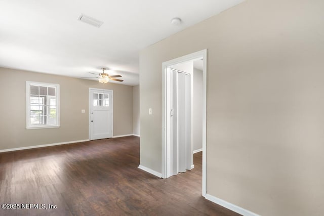 937 Stark St, Jacksonville, FL 32208 - foyer entrance featuring baseboards, ceiling fan, and dark wood-style flooring