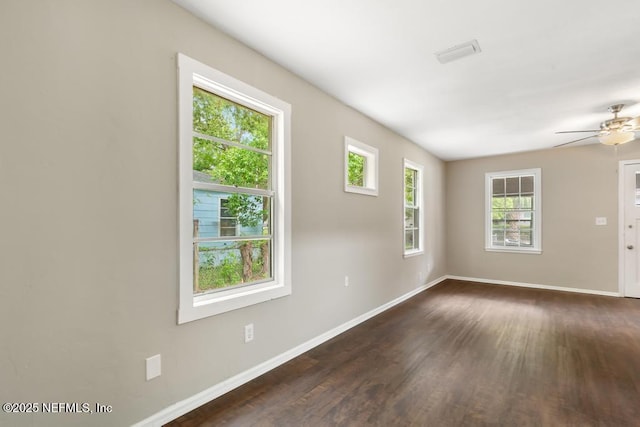 937 Stark St, Jacksonville, FL 32208 - spare room featuring baseboards, dark wood-style flooring, and a ceiling fan