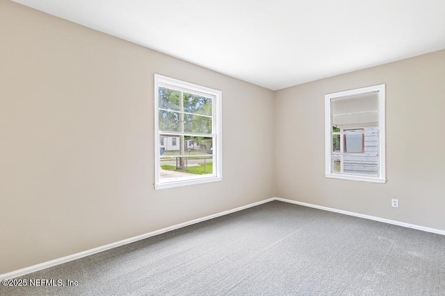 937 Stark St, Jacksonville, FL 32208 - carpeted empty room with baseboards