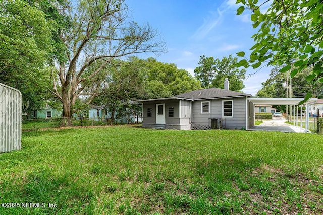937 Stark St, Jacksonville, FL 32208 - rear view of house featuring a chimney, cooling unit, and roof with shingles