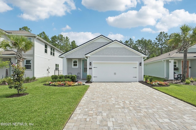 285 Greenway Ln, Saint Augustine, FL 32092 - view of front facade with decorative driveway, a front lawn, and a garage