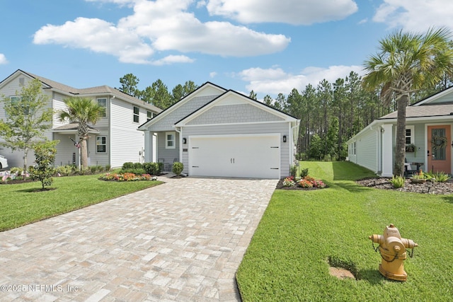 285 Greenway Ln, Saint Augustine, FL 32092 - view of front of house with decorative driveway, a front yard, and a garage