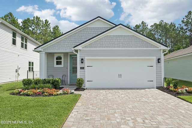 285 Greenway Ln, Saint Augustine, FL 32092 - craftsman house with decorative driveway, a front lawn, and an attached garage