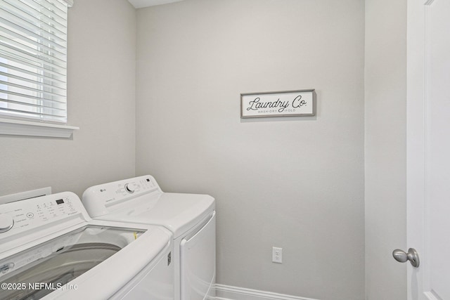 285 Greenway Ln, Saint Augustine, FL 32092 - washroom featuring washing machine and dryer and baseboards